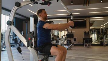 Man training chest on butterfly gym machine video
