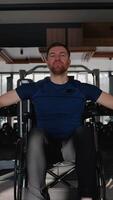 Wheelchair user training back with lat pulldown machine video