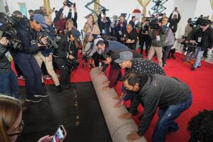 Workers during the ceremonial “red carpet rollout” event before the 94th annual Academy Awards at the Dolby Theatre on March 9, 2024. editorial_image