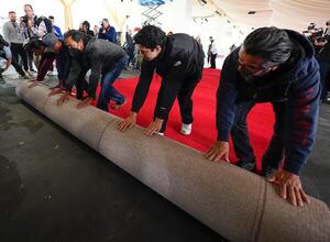 Workers during the ceremonial “red carpet rollout” event before the 94th annual Academy Awards at the Dolby Theatre on March 9, 2024. editorial_image