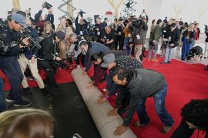 Workers during the ceremonial “red carpet rollout” event before the 94th annual Academy Awards at the Dolby Theatre on March 9, 2024. editorial_image