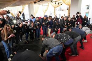 Workers during the ceremonial “red carpet rollout” event before the 94th annual Academy Awards at the Dolby Theatre on March 9, 2024. editorial_image