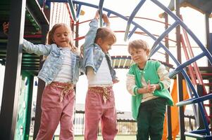 Front view. Kids are, having, fun on the playground photo