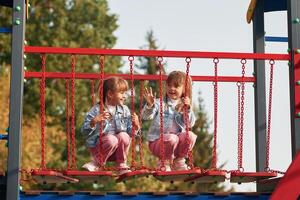 Two girls. Kids are having, fun on the playground photo