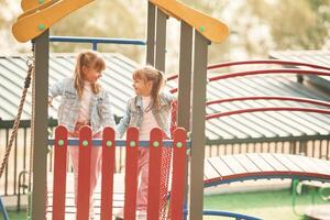 Two girls. ,Kids are having fun on the playground photo
