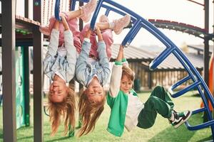 Cheerful ,,kids are having fun on the playground photo