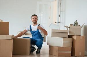Room full of boxes. Moving service employee photo