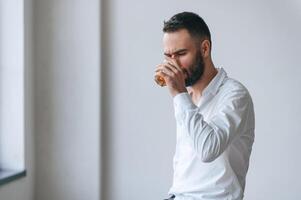 Upset young man drinker alcoholic,, is, indoors photo