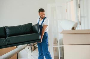 Moving service, employee in a room photo