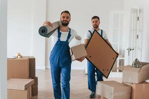 Two,, moving service employees in a room photo