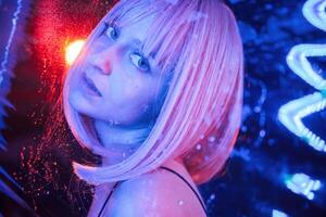 Posing for, camera. Stylish woman with ,white hair is behind wet transparent plastic sheet photo