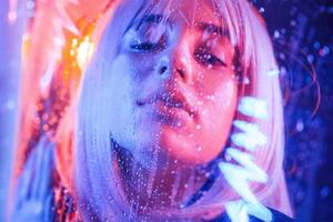 Focused close up,, view. Stylish woman with white hair is behind wet transparent plastic sheet photo