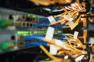 Blue and yellow wires., Close up view of hardware in the server room photo