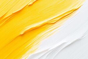A close up of a yellow and white paint brush photo