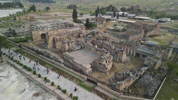 Ancient ruins of Hierapolis in semicircular aerial layout video