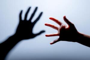Emotional connection between two hands reaching out, symbolizing longing and desire for closeness, representing human relationships and bonds, emotional connection concept photo
