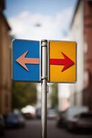 Directional signpost with blue left arrow and red right arrow indicating choices in urban setting, navigation concept photo