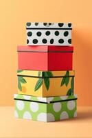 Stack of colorful boxes with floral and polka dot patterns creating visual interest photo