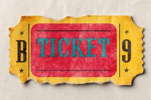 Retro ticket for a pop concert lying on a textured background photo