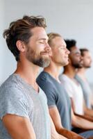 Group of multi-ethnic men practicing yoga and meditating together photo