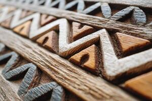 Close-up of intricate Polynesian hand-carved wooden panel showcasing traditional patterns photo