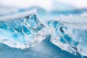 Close-up of textured cracked ice cube creating a bridge shape photo