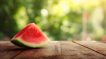 Bright watermelon slice displayed on an old wooden table against a lively summer background. photo