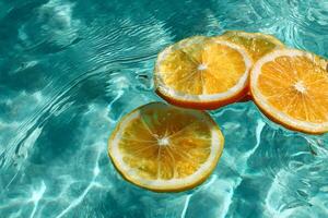 Elegant lemon slices gently resting on the shimmering surface of a turquoise pool. photo