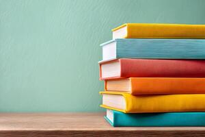 Brightly colored books stacked neatly on natural wood shelf in educational setting photo