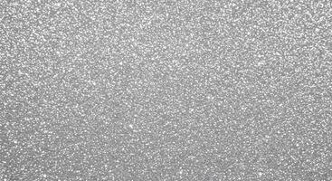 Fine silver glitter particles in seamless layout, great for elegant product backgrounds. photo