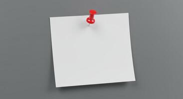 Blank white paper note pinned to gray wall, suitable for advertisements, announcements, reminders, or as a background for quotes or text overlays photo