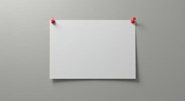 Blank white paper note pinned to gray wall photo
