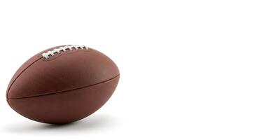 Brown leather football on a white background suitable for sports websites, blog posts, social media graphics, and product design. photo