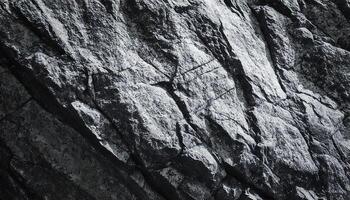 Grayscale Close-up view of rugged Textured Rocky Surface high contrast with Contrasting Patterns photo