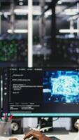 Data center employee talking in headset mic, coordinating technicians setting up hardware for artificial intelligence deployment. Server room worker engages in remote call with engineers, camera A video