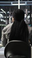 Data center worker applies deep learning node tree programming to analyze datasets for operational insights. Server hub admin uses visual programming to identify patterns in facility data, camera A video