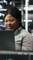 Vertical Annoyed data center IT expert having malfunctioning gear while using node tree tool. Frustrated server hub technician upset by errors while using AI visualization to optimize system health, camera B video