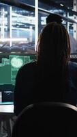Panicked engineer in AI server facility reacts to hacking incident involving theft of sensitive data. Data center employee alarmed by computer virus triggered by security systems, camera A video