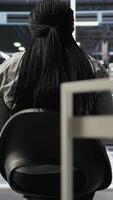 Vertical Server farm IT specialist using PC to apply artificial intelligence technology minimizing system downtime. Engineer using computer to develop and deploy AI solutions optimizing equipment, camera A video