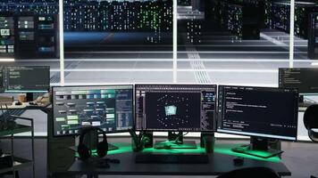 Monitors in data center displaying node tree interfaces monitoring infrastructure health. Visual programming systems on workstations helping identify malfunctions in server room equipment, jib down video