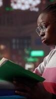 Vertical Female pupil struggling to stay focused and awake while researching, writing on her bachelor paper at the library in order to obtain her university diploma. Complete studies. Camera A. video