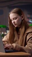 Vertical Young adult studying in the university library to obtain her diploma and a scholarship, using academic database for research. Student generating creative ideas for the bachelor paper. Camera A. video
