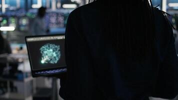 Server hub technician arriving in office, using AI visualization insights on PC to optimize system health. Data center IT specialist using computer node tree software to analyze gear issues, camera A video