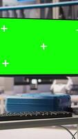Vertical Green screen monitor in industry 4.0 smart industrial plant equipped with advanced sensors used to check production equipment performance. Robotics software on chroma key screen in smart factory video