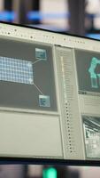 Vertical Monitor in smart photovoltaics factory analyzing performance data to optimize operations. Display in industry 4.0 solar panels plant conducting preventive maintenance for equipment through IoT sensors video