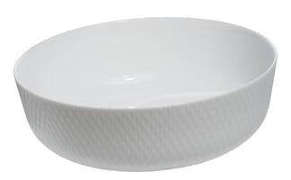 White ceramic round salad plate on isolated background photo