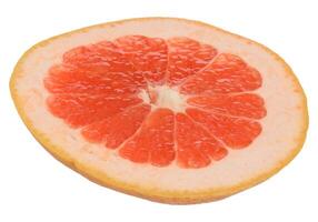 A slice of ripe grapefruit on an isolated background. photo