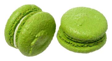 Green macaron with a creamy white filling, isolated background photo