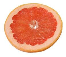 A slice of ripe grapefruit on an isolated background photo