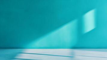 Minimalist Room With Teal Wall and Soft Sunlight Casting Shadows Through a Window. photo